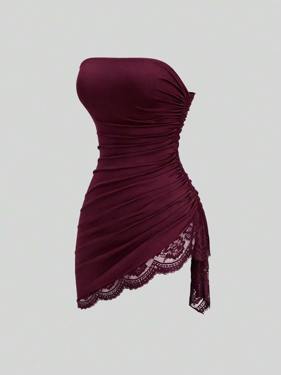 Women's black strapless lace patchwork bodycon mini dress featuring a slim fit design and an asymmetrical hem.
