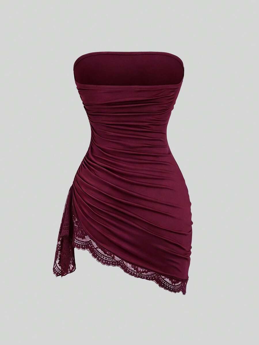 Women's black strapless lace patchwork bodycon mini dress featuring a slim fit design and an asymmetrical hem.