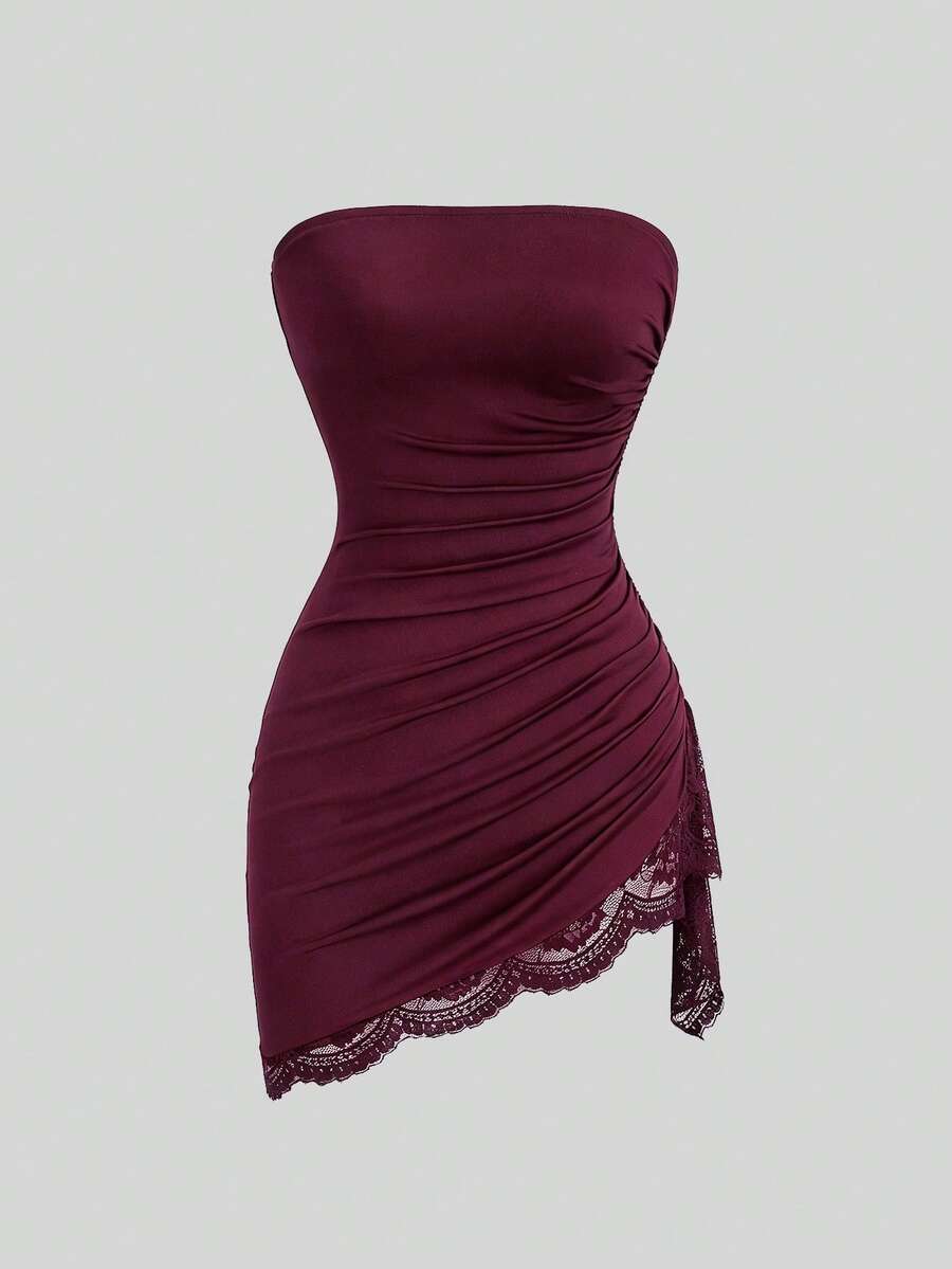 Women's black strapless lace patchwork bodycon mini dress featuring a slim fit design and an asymmetrical hem.
