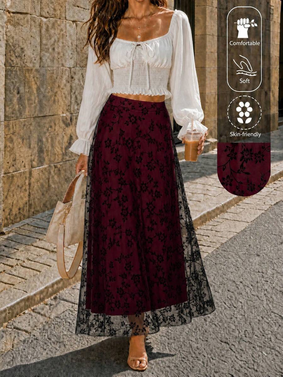 Women's high waist floral embroidered A-line long skirt with elegant flared mesh design.