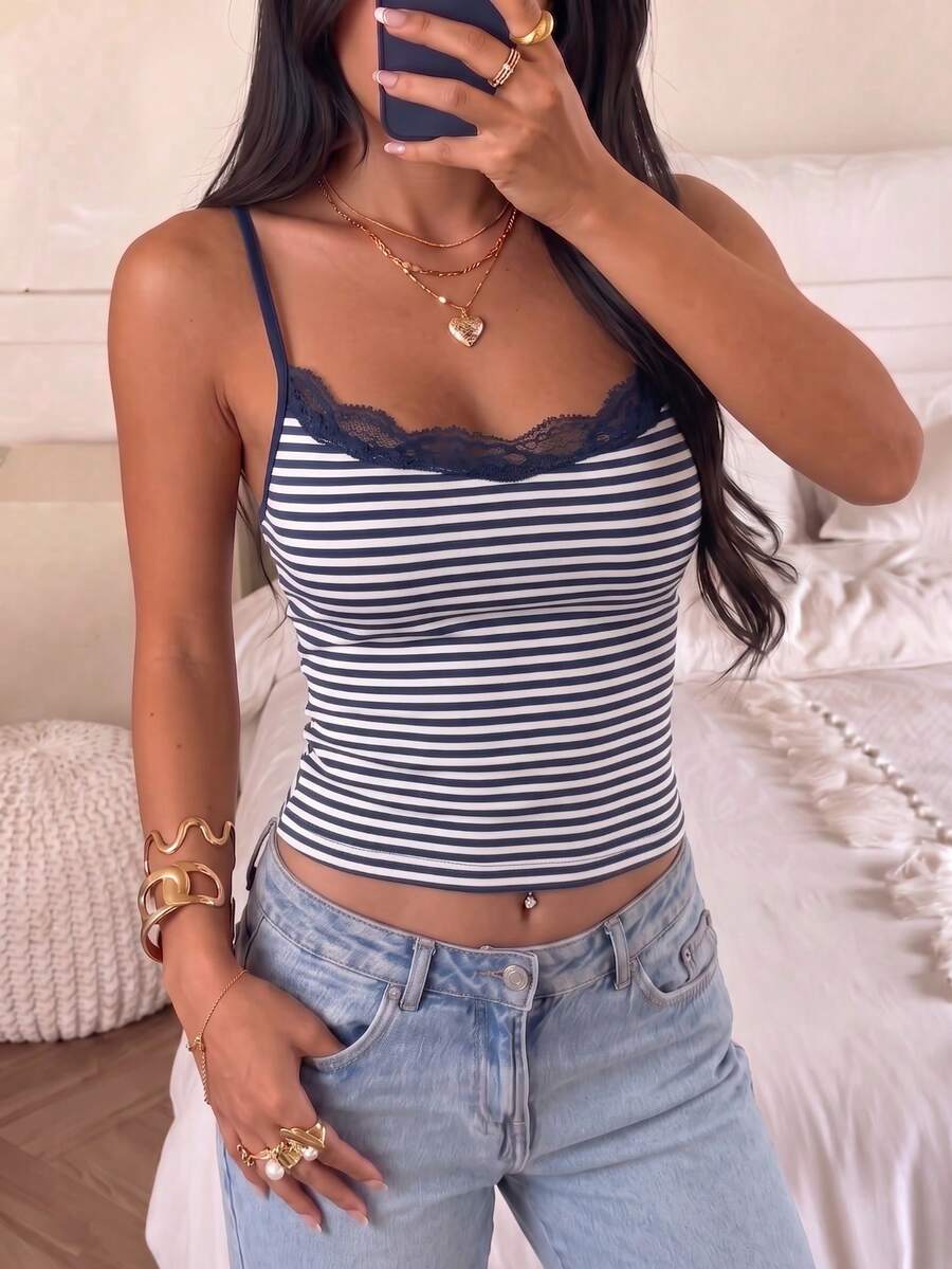 Black striped slim fit camisole top featuring contrast lace trim and delicate spaghetti straps.