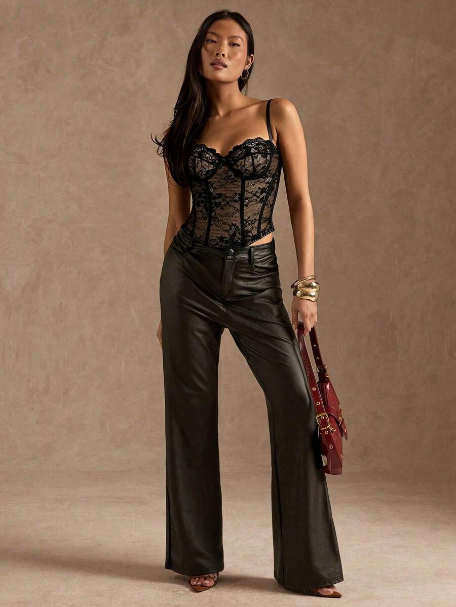 Black women’s lace cami top with spaghetti straps, contrast lace details, and an asymmetrical hem, styled as a slim-fit lined casual top.