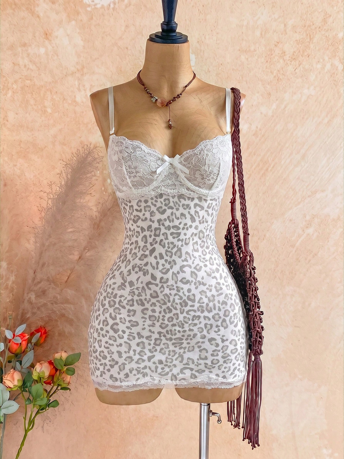 Women's black mesh bodycon mini dress featuring spaghetti straps, contrast lace cup details, backless styling, and a slim fit.