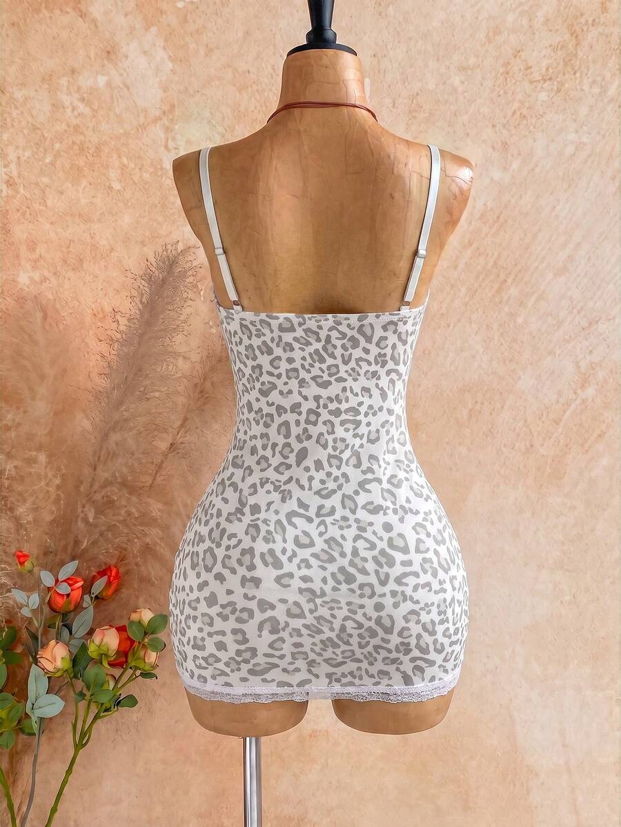 Women's black mesh bodycon mini dress featuring spaghetti straps, contrast lace cup details, backless styling, and a slim fit.