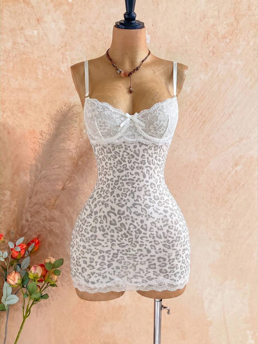 Women's black mesh bodycon mini dress featuring spaghetti straps, contrast lace cup details, backless styling, and a slim fit.