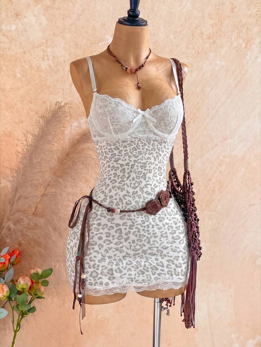 Women's black mesh bodycon mini dress featuring spaghetti straps, contrast lace cup details, backless styling, and a slim fit.