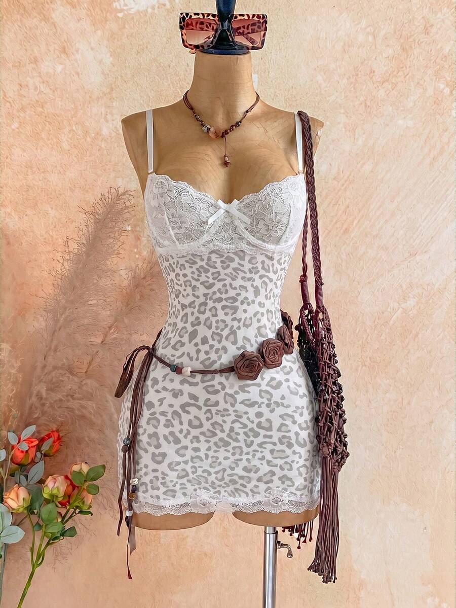 Women's black mesh bodycon mini dress featuring spaghetti straps, contrast lace cup details, backless styling, and a slim fit.