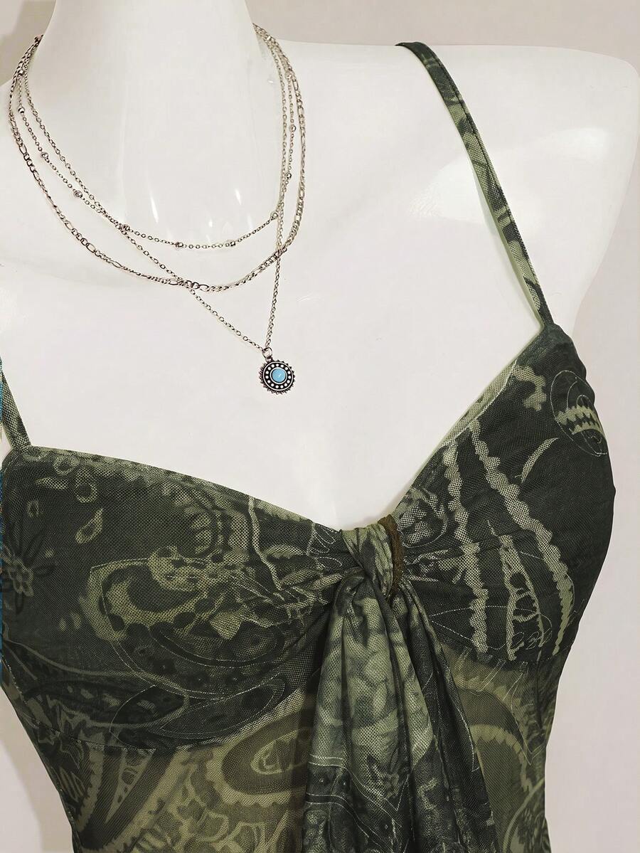Burgundy paisley print ruched cami top for women featuring thin spaghetti straps, asymmetrical lace-up detail, and a slim fit.