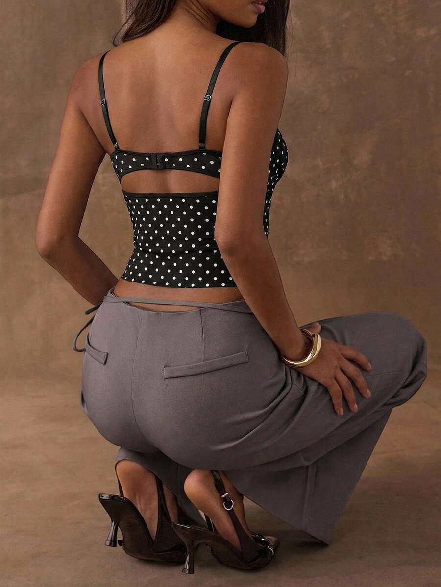 Women's black contrast lace camisole with spaghetti straps, cup detail, semi-sheer finish, and slim fit for going out or date night.
