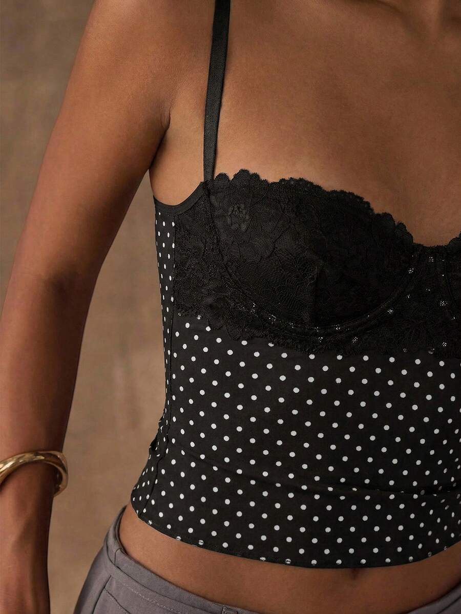 Women's black contrast lace camisole with spaghetti straps, cup detail, semi-sheer finish, and slim fit for going out or date night.