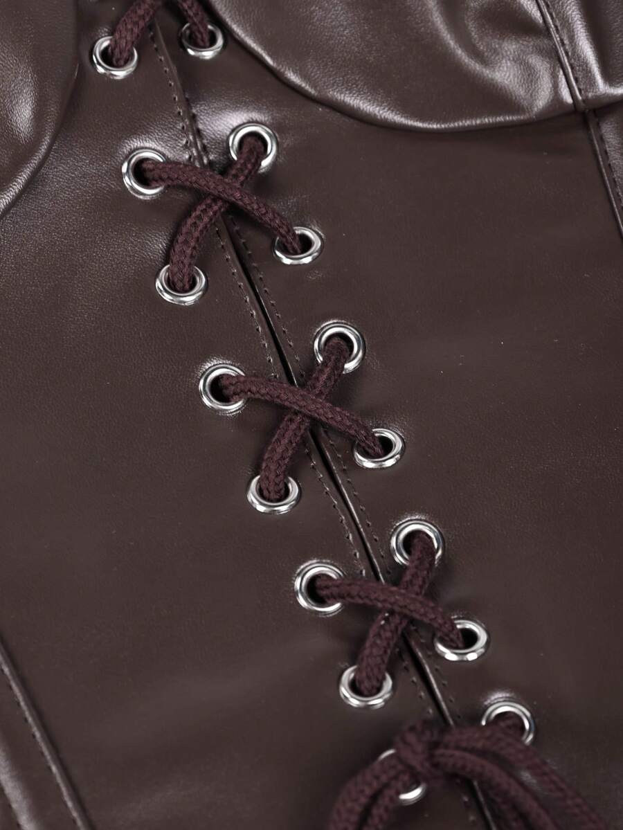 Women's black PU leather fishbone corset crop top featuring a lace-up front with metal eyelets and an asymmetrical hem.