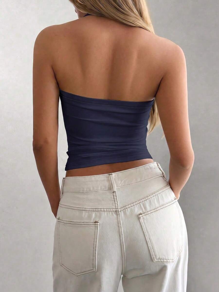 Women's striped halter camisole top featuring a backless design in knitted fabric