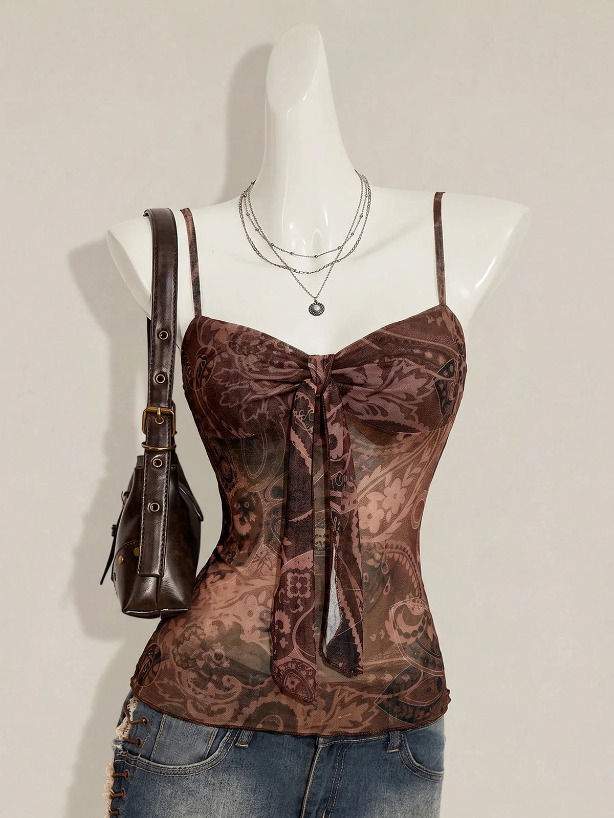 Burgundy paisley print ruched cami top for women featuring thin spaghetti straps, asymmetrical lace-up detail, and a slim fit.