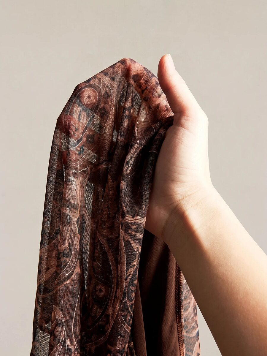 Burgundy paisley print ruched cami top for women featuring thin spaghetti straps, asymmetrical lace-up detail, and a slim fit.