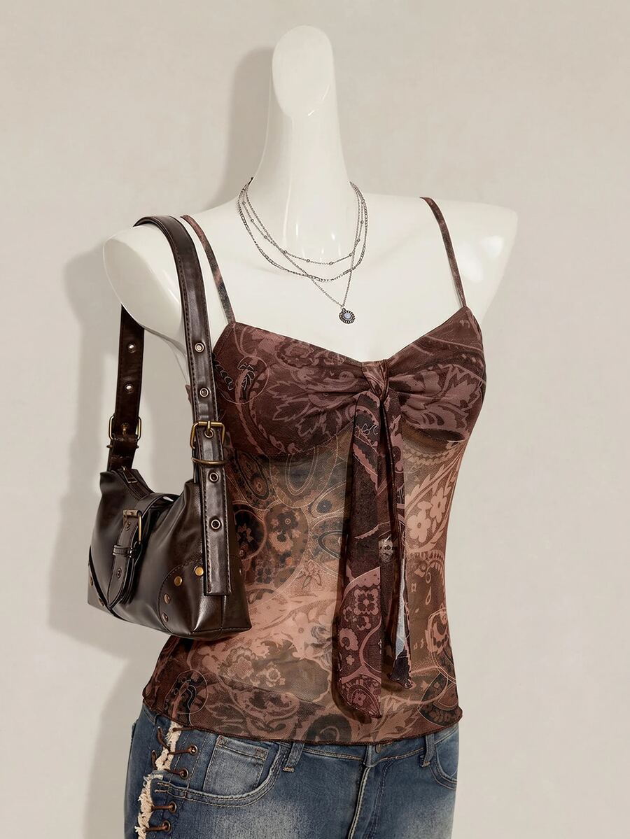 Burgundy paisley print ruched cami top for women featuring thin spaghetti straps, asymmetrical lace-up detail, and a slim fit.