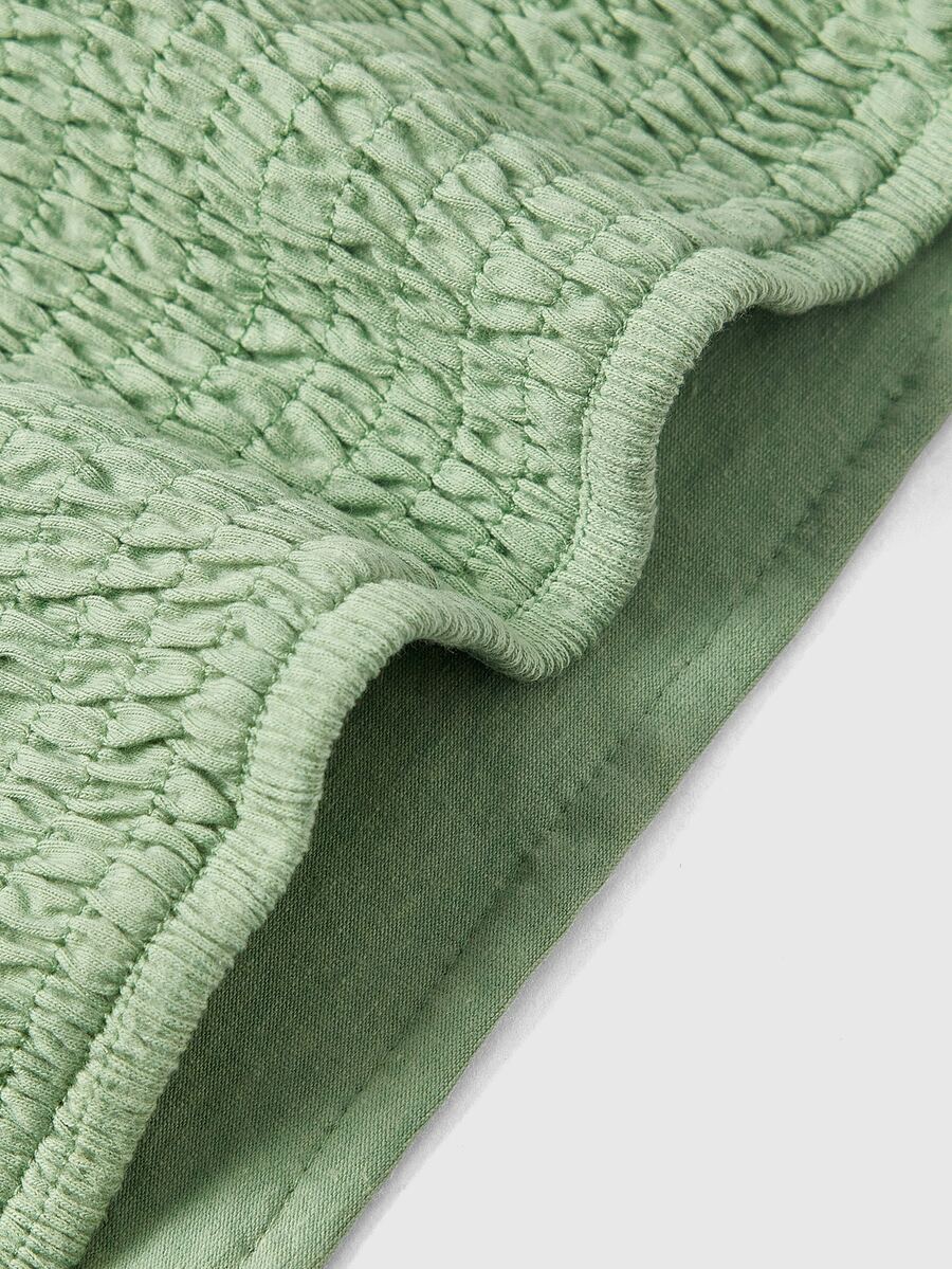 Women's floral embroidery backless halter crop top featuring contrast lace, ruched detailing, and slim fit in knitted pink fabric.