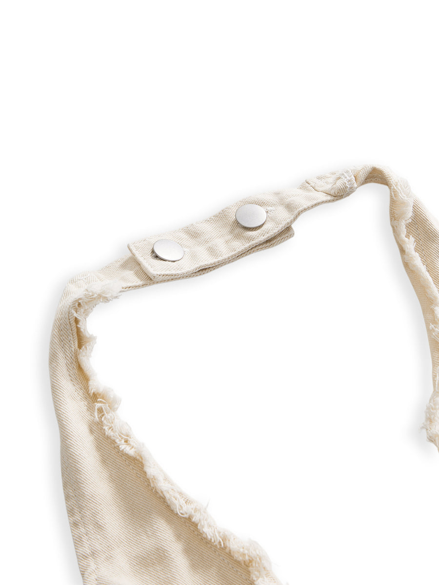 Women's denim halter crop top featuring a backless design, asymmetrical hem, single-breasted front, and lettuce trim.