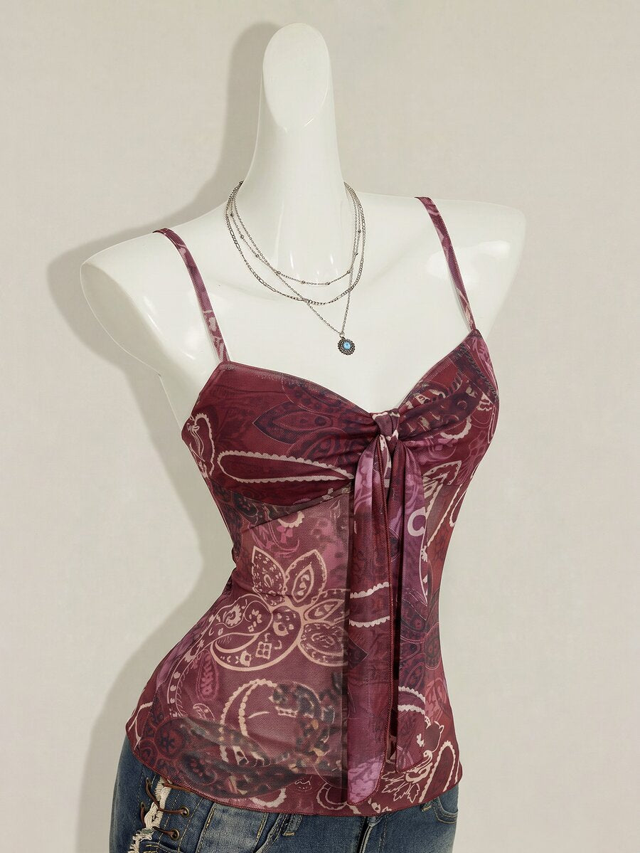 Burgundy paisley print ruched cami top for women featuring thin spaghetti straps, asymmetrical lace-up detail, and a slim fit.