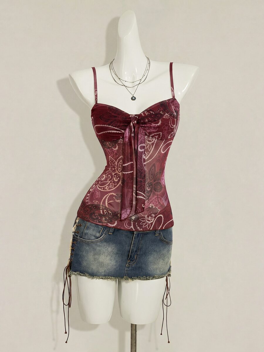 Burgundy paisley print ruched cami top for women featuring thin spaghetti straps, asymmetrical lace-up detail, and a slim fit.