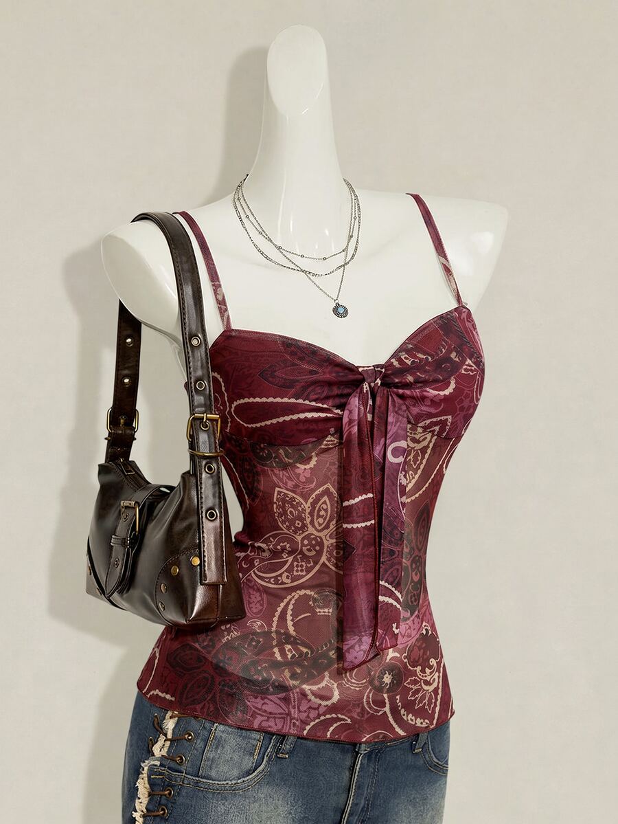 Burgundy paisley print ruched cami top for women featuring thin spaghetti straps, asymmetrical lace-up detail, and a slim fit.