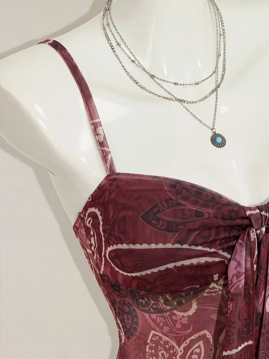 Burgundy paisley print ruched cami top for women featuring thin spaghetti straps, asymmetrical lace-up detail, and a slim fit.