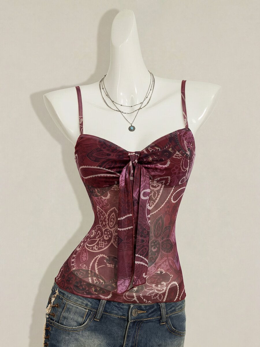 Burgundy paisley print ruched cami top for women featuring thin spaghetti straps, asymmetrical lace-up detail, and a slim fit.