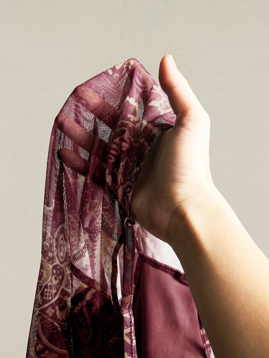 Burgundy paisley print ruched cami top for women featuring thin spaghetti straps, asymmetrical lace-up detail, and a slim fit.