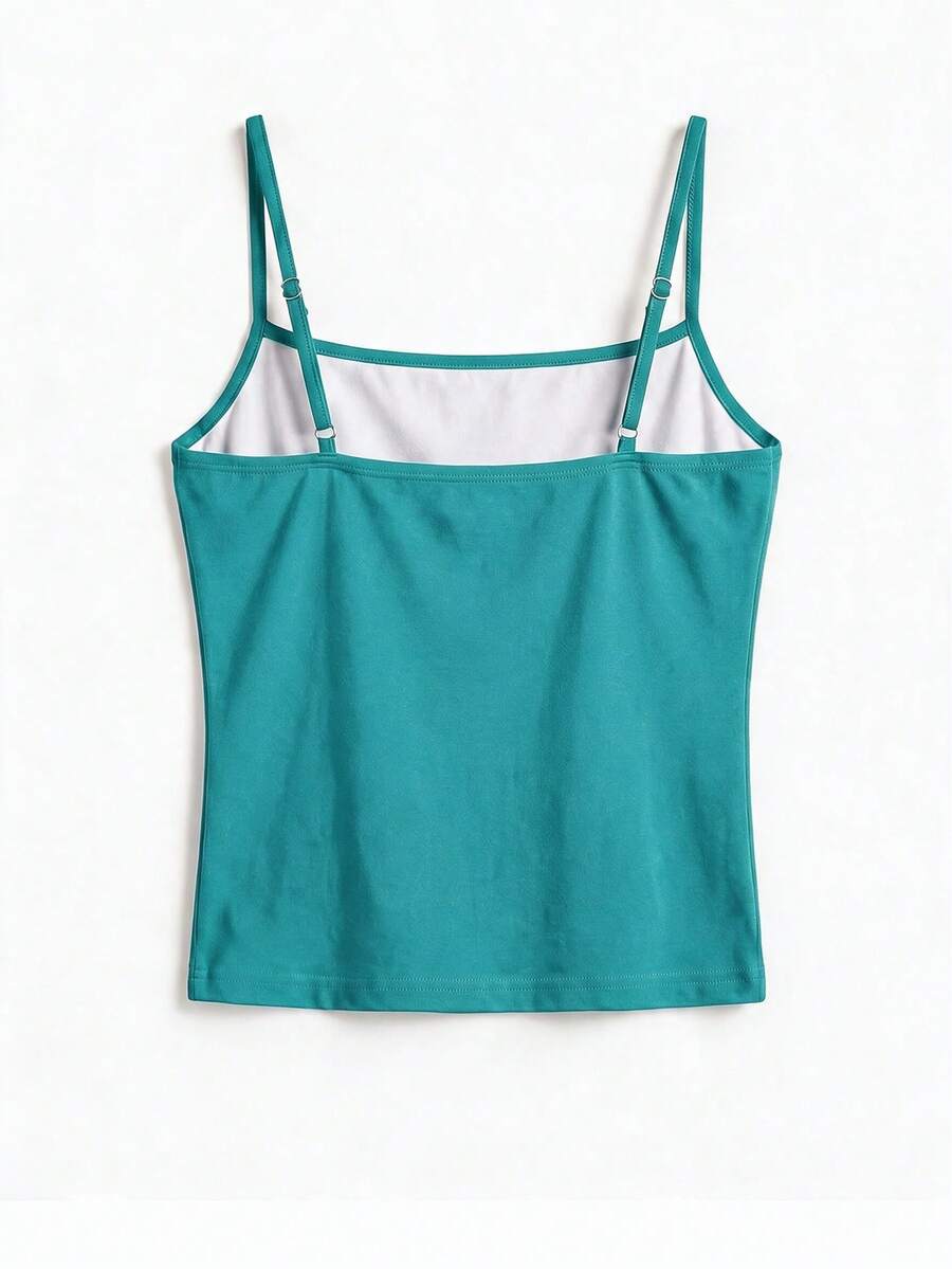 Women's blue floral print spaghetti strap camisole top in a slim fit short length design