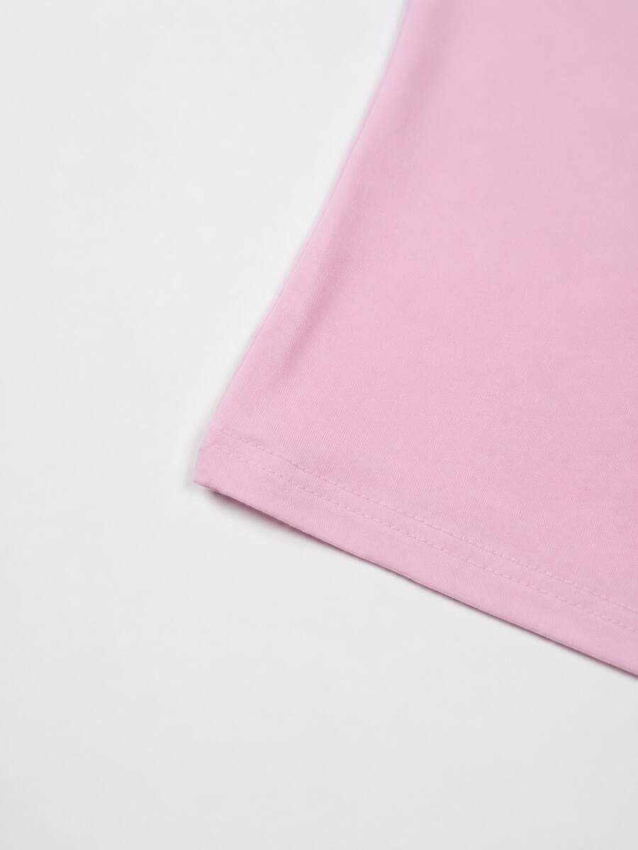 A slim fit women's crop cami tank top with spaghetti straps and a solid color design, made from comfortable stretch knitted fabric.