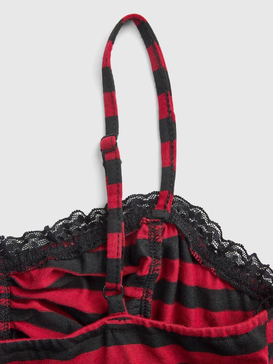 A black gothic slim-fit tank top featuring contrast lace patchwork detailing, ruched frill trim, and thin spaghetti straps made from soft knitted stretch fabric.