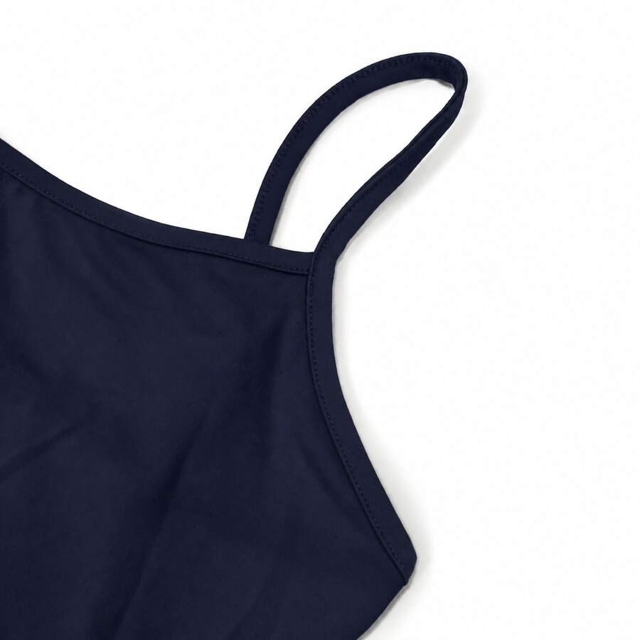 Navy blue women's geometric print spaghetti strap cami tank top with regular fit on plain background.
