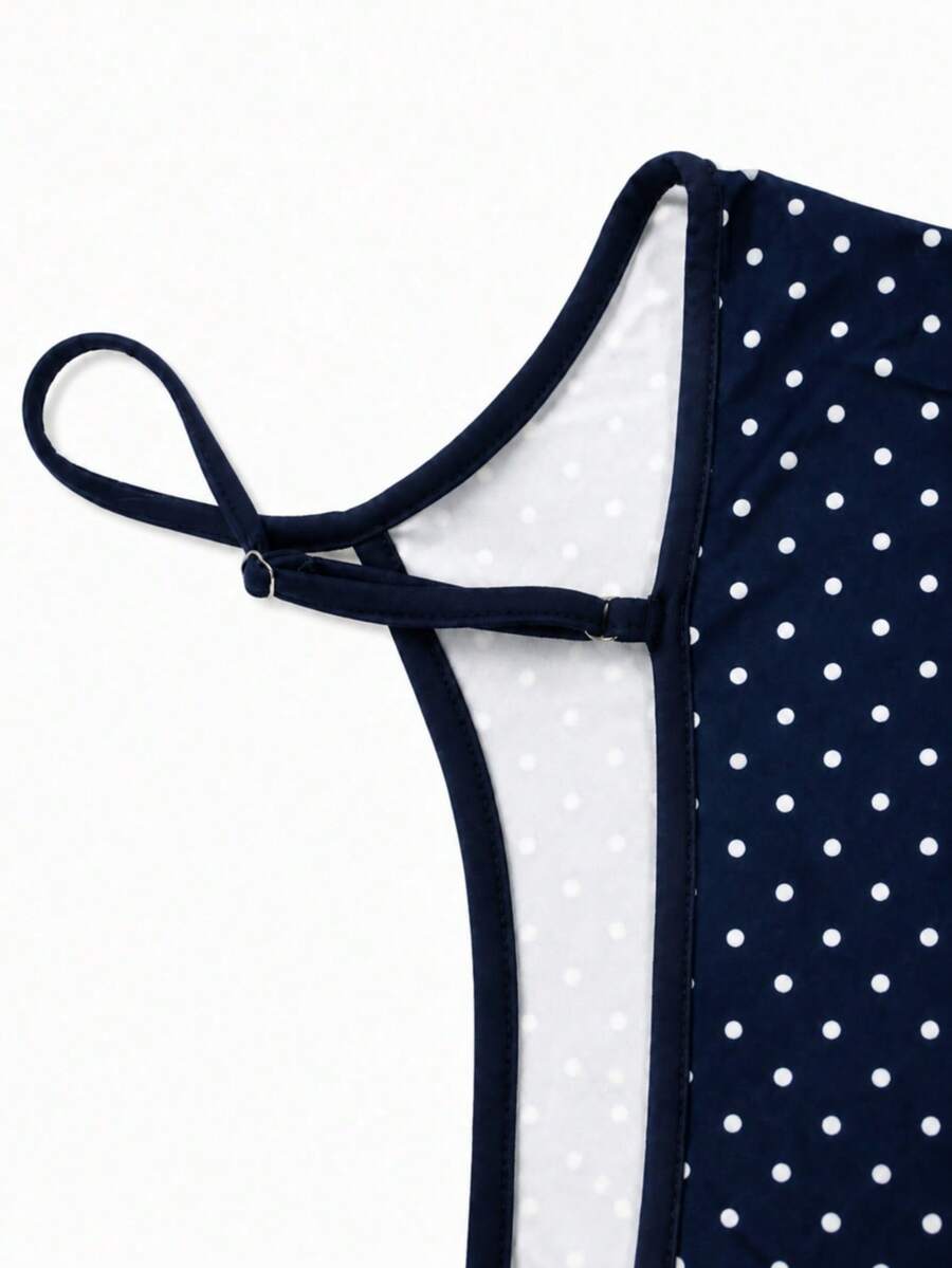 Navy blue women's geometric print spaghetti strap cami tank top with regular fit on plain background.
