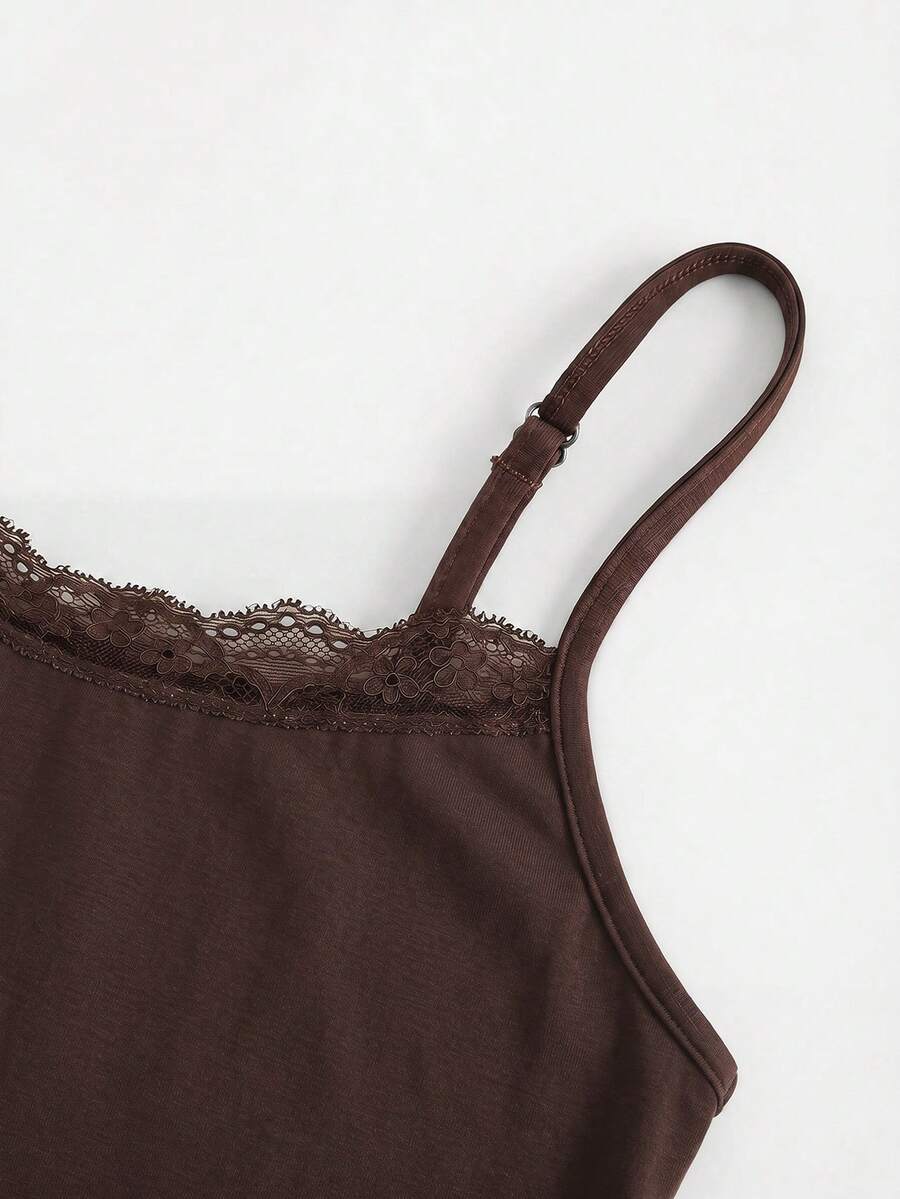 Black striped slim fit camisole top featuring contrast lace trim and delicate spaghetti straps.