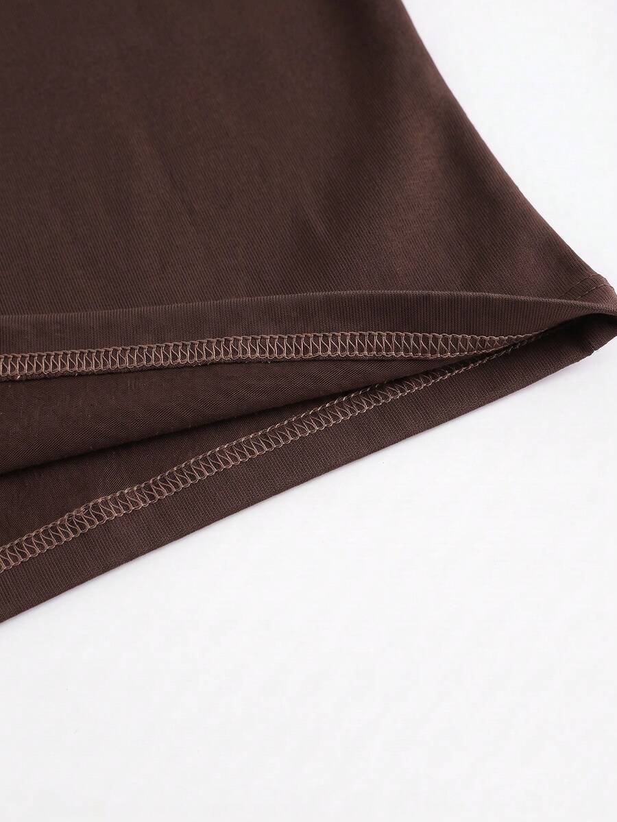 Black striped slim fit camisole top featuring contrast lace trim and delicate spaghetti straps.