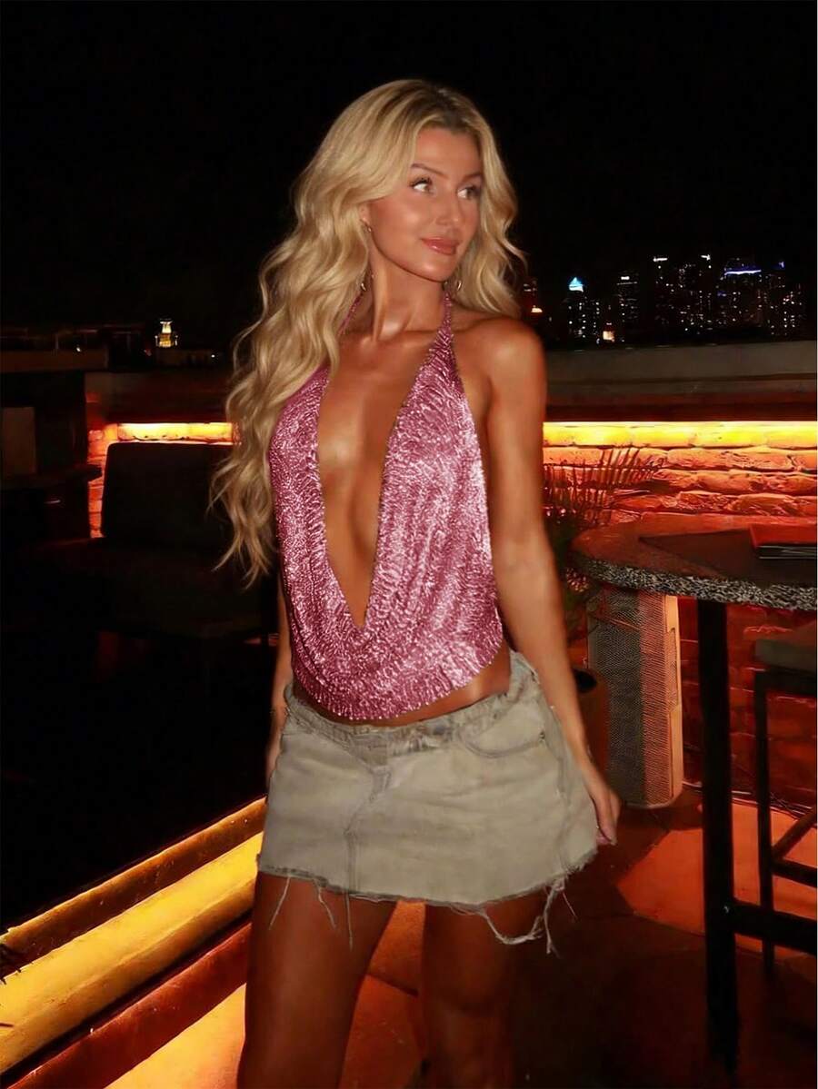 Women's cowl neck metallic knit tank top with thin spaghetti straps and a backless draped silhouette.