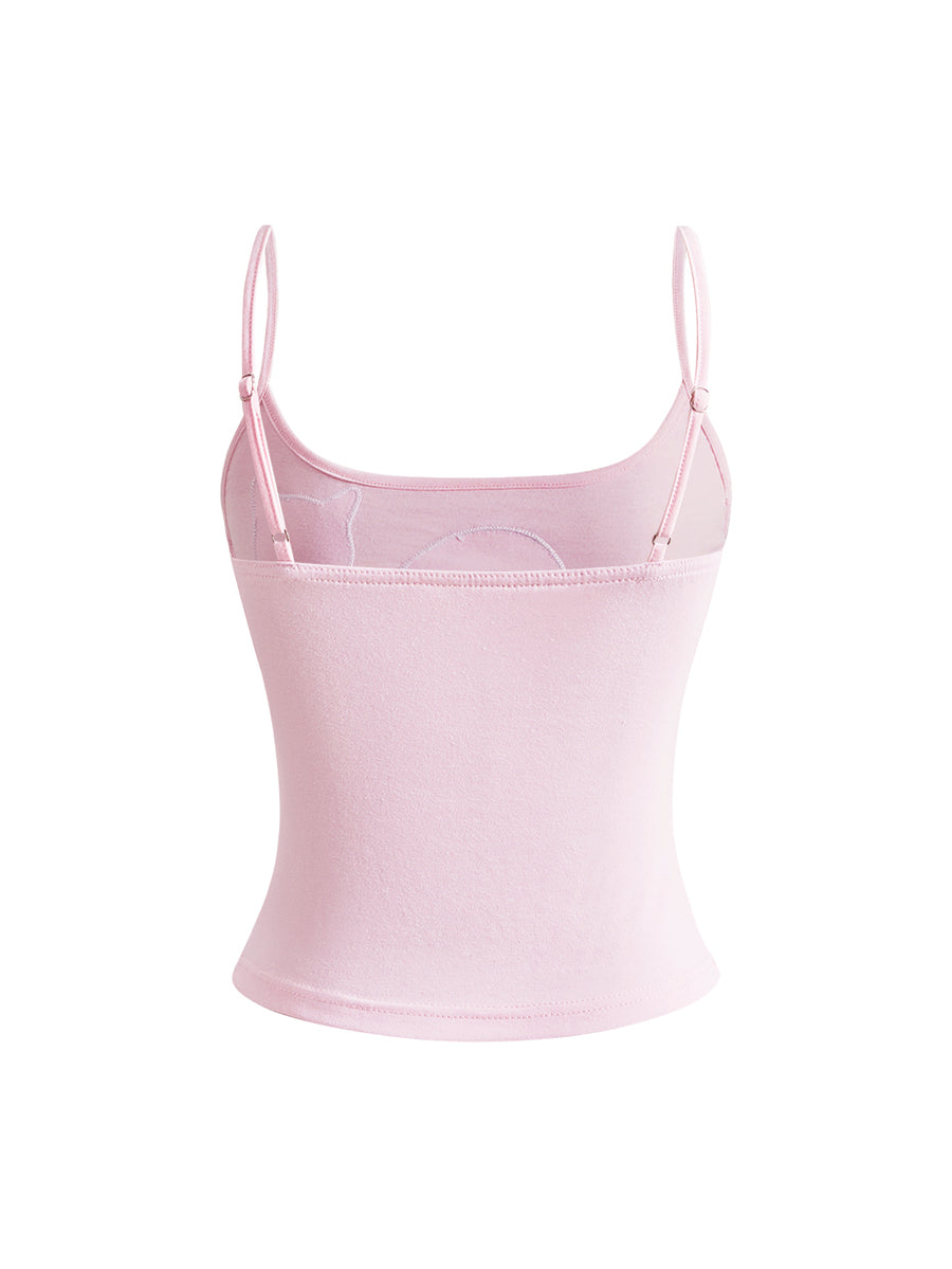 A women's pink slim fit tank top featuring a polka dot pattern, cute cat embroidery applique with a 3D bow, and thin spaghetti straps.