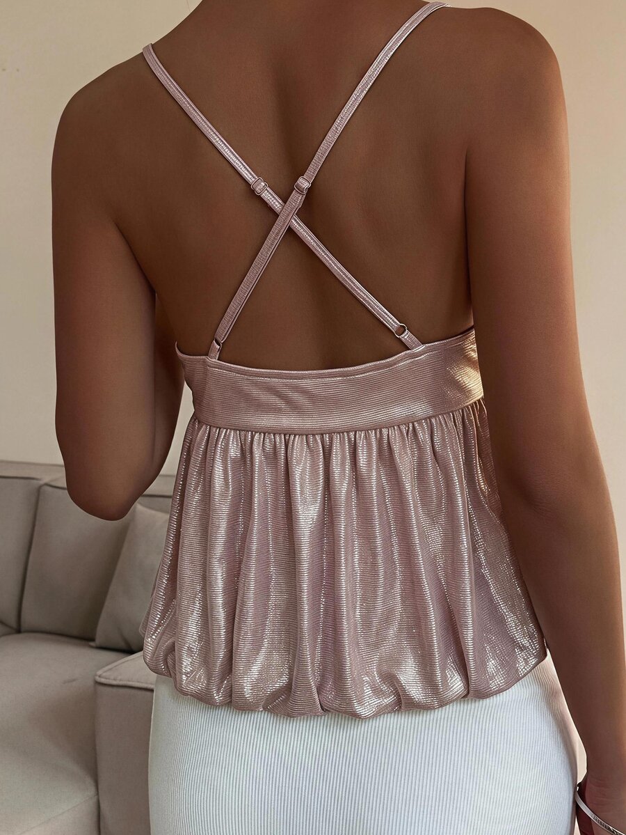 Burgundy sequin spaghetti strap cami top featuring a backless design and flared ruffle hem.