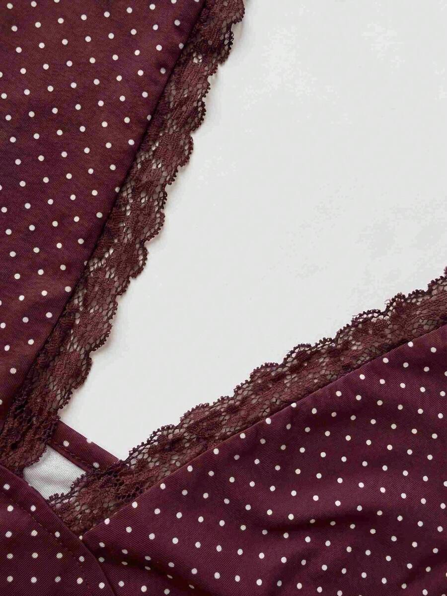 Women's sleeveless halter crop top featuring contrast lace trim and a slim fit design.