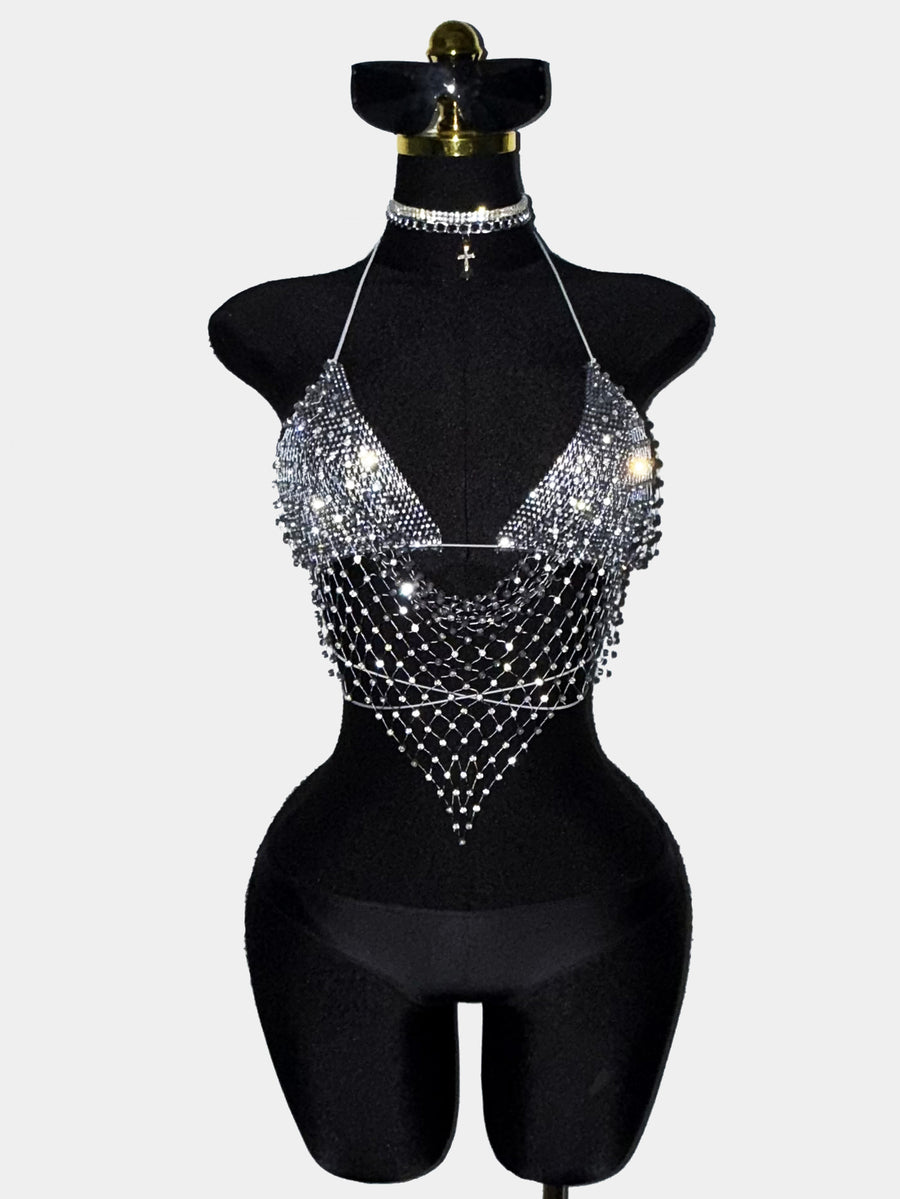 Black sheer mesh halter top for women featuring rhinestone glitter effect, backless design, chain details, and an asymmetrical hem.