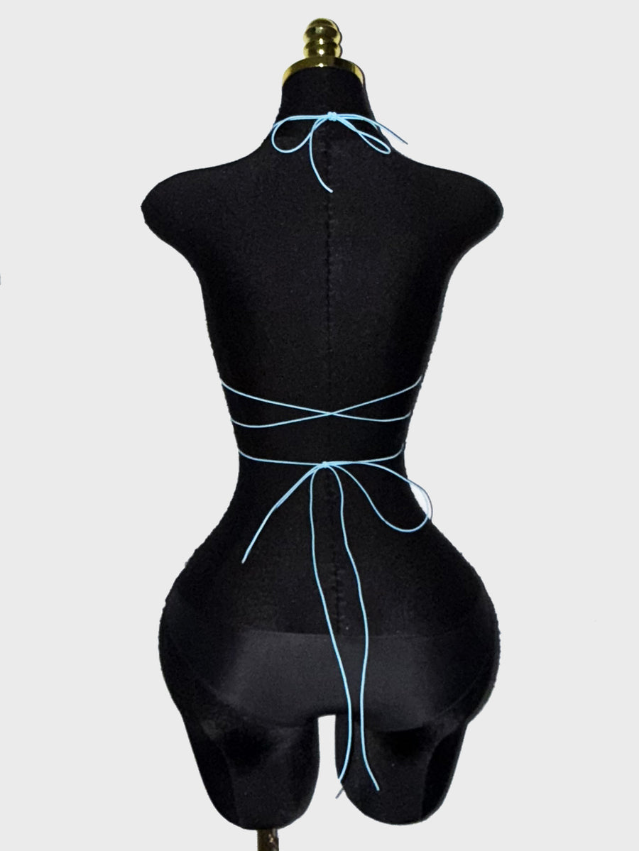 Black sheer mesh halter top for women featuring rhinestone glitter effect, backless design, chain details, and an asymmetrical hem.