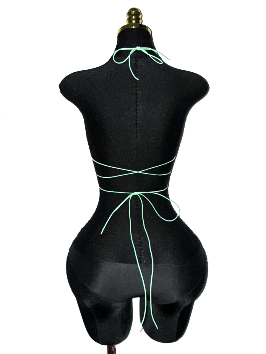 Black sheer mesh halter top for women featuring rhinestone glitter effect, backless design, chain details, and an asymmetrical hem.