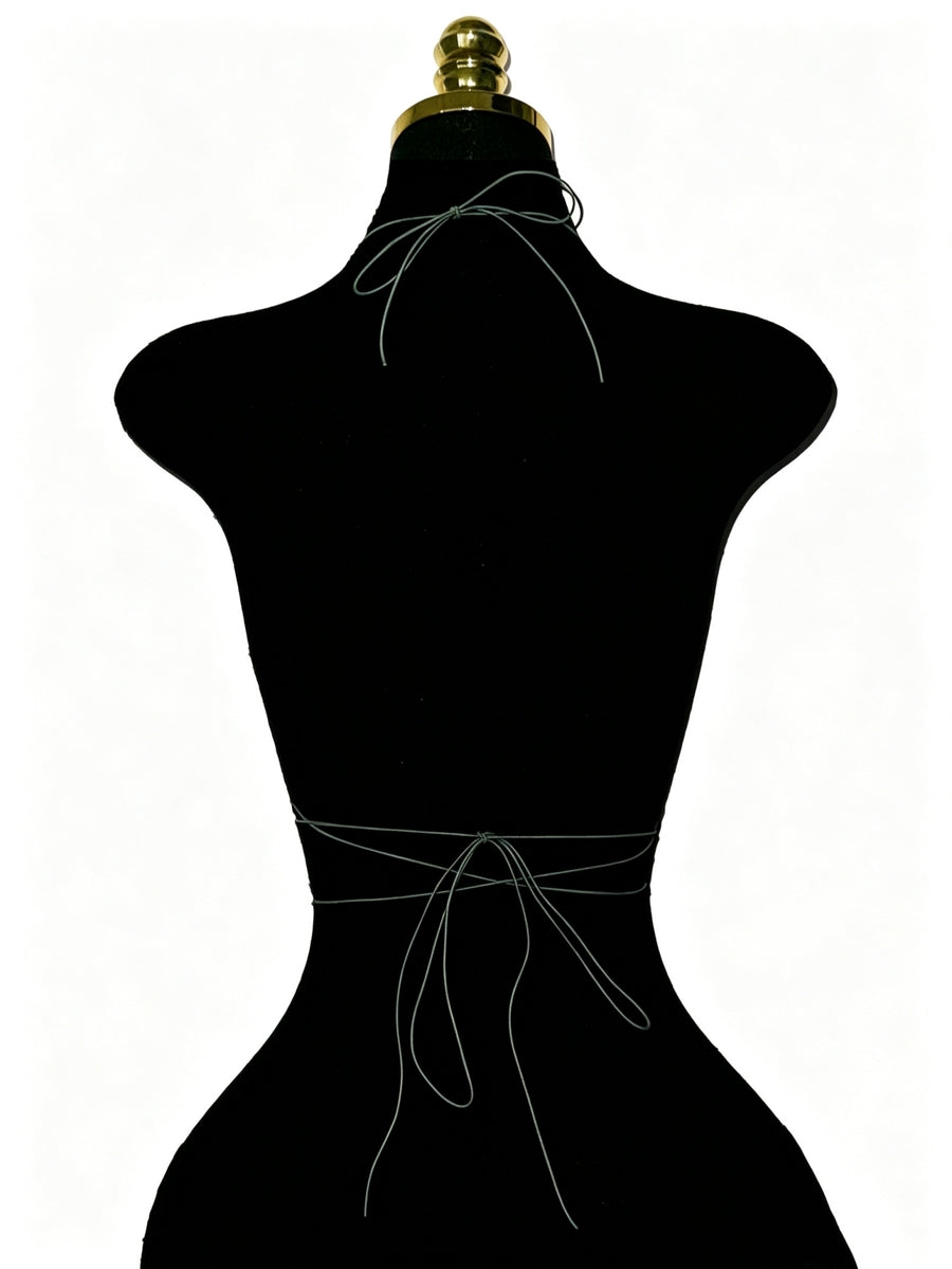 Black sheer mesh halter top for women featuring rhinestone glitter effect, backless design, chain details, and an asymmetrical hem.