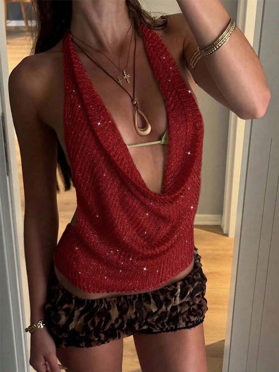Women's cowl neck metallic knit tank top with thin spaghetti straps and a backless draped silhouette.