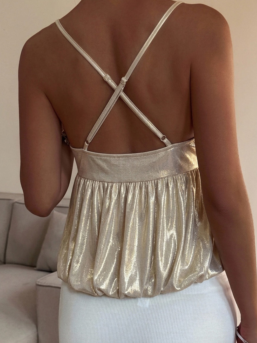 Burgundy sequin spaghetti strap cami top featuring a backless design and flared ruffle hem.