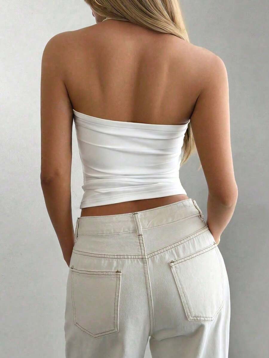 Women's striped halter camisole top featuring a backless design in knitted fabric