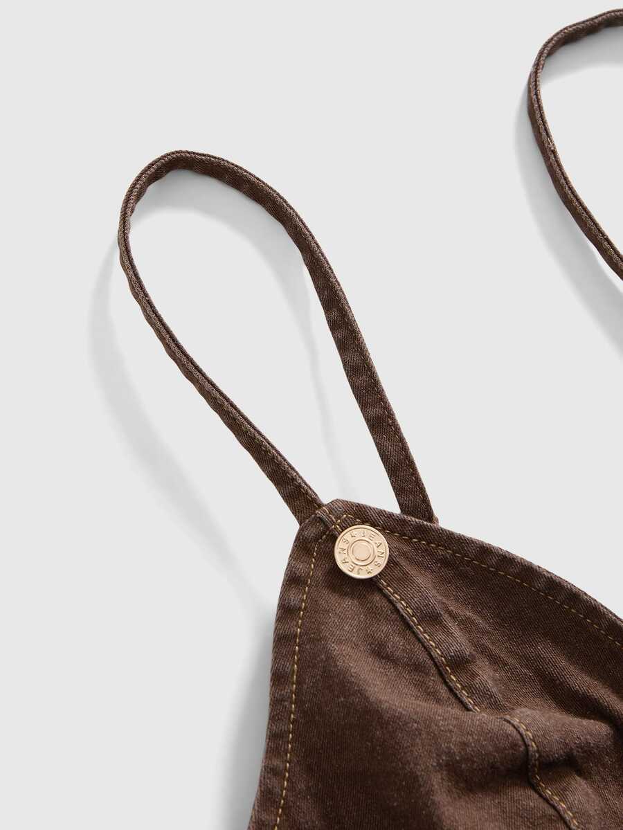 Women's blue fitted denim camisole top featuring metal buckle details, ruched cup design, zipper placket, and thin spaghetti straps.