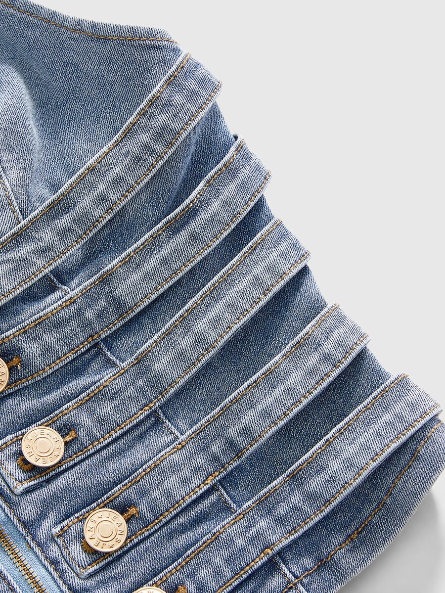 Women's blue fitted denim camisole top featuring metal buckle details, ruched cup design, zipper placket, and thin spaghetti straps.