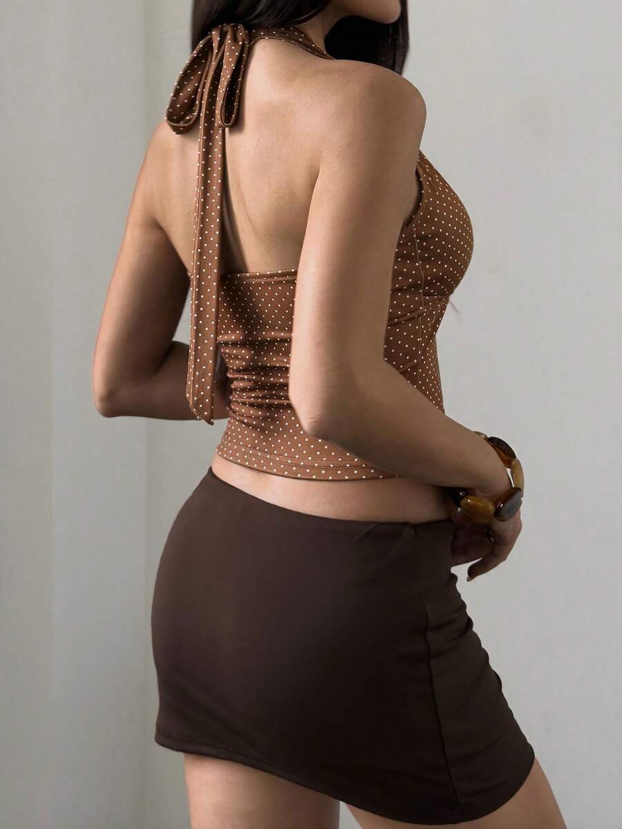 Women's sleeveless halter crop top featuring contrast lace trim and a slim fit design.