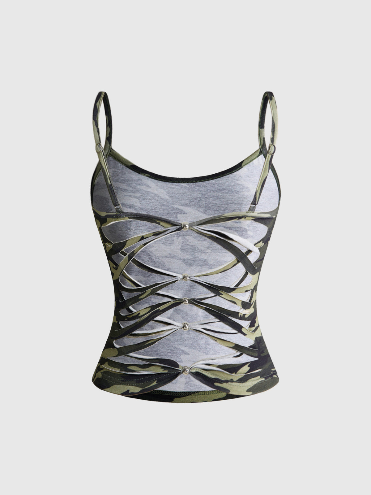 Woman wearing a black backless halter tank top with criss-cross details and textured knit fabric