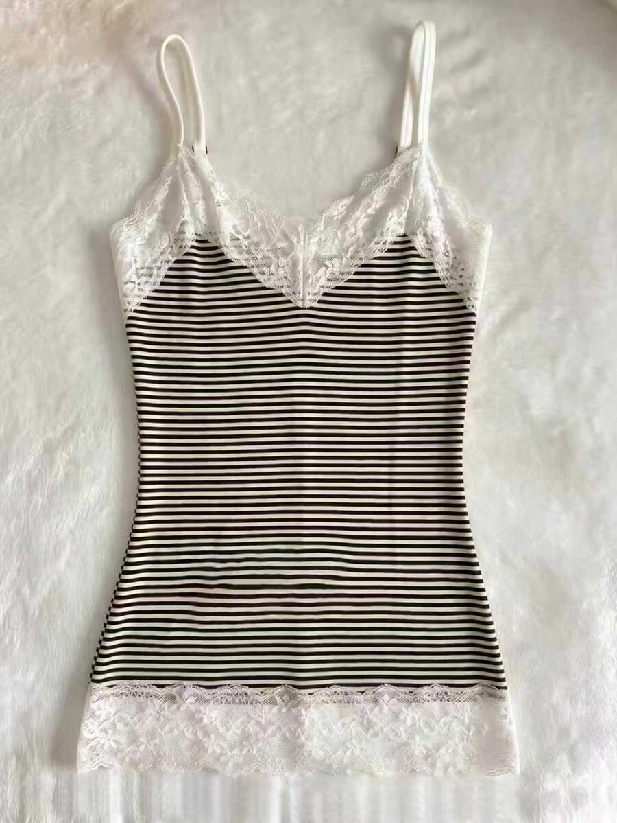 Women's solid color slim fit camisole top featuring delicate lace patchwork embroidery and tank straps.
